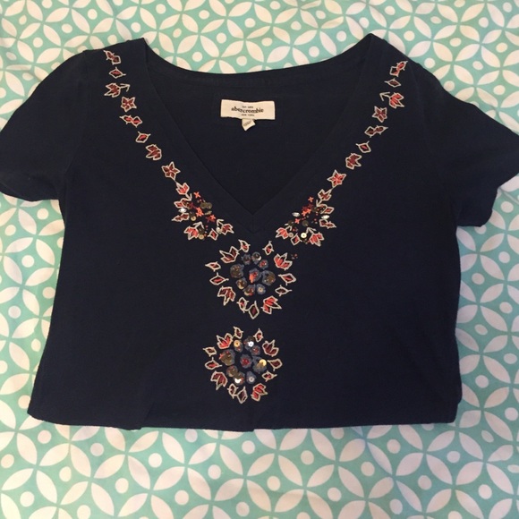 Blue vNeck with pattern around neckline