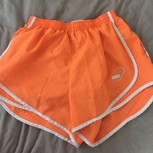 Orange running shorts
