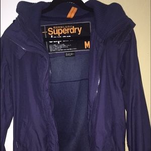 A navy blue Superdry Windcheater jacket