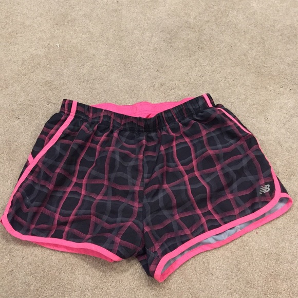 black and pink new balance sport shorts