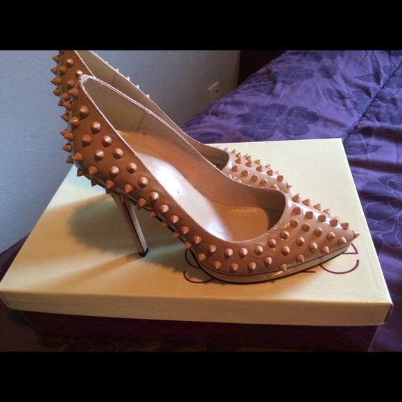 Tan spiked patent leather heels