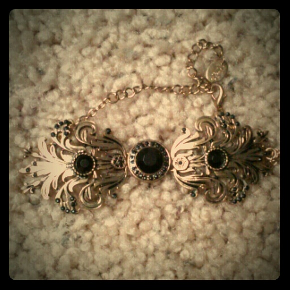 Gold bracelet w/ black gems