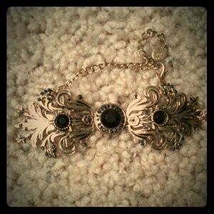 Gold bracelet w/ black gems