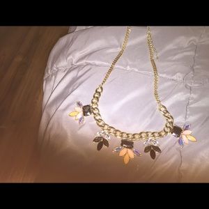 Lovely gray and pink gold tone necklace.