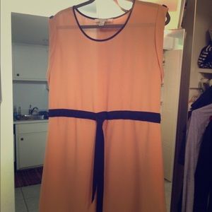 Nude dress with black belt and buttons