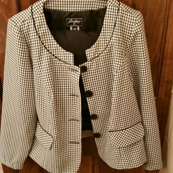 A skirt and jacket business suit.