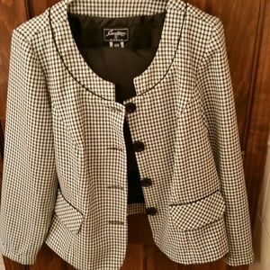 A skirt and jacket business suit.