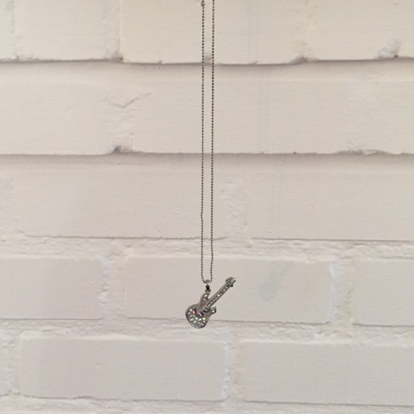 Long sparkly guitar necklace.