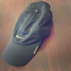 black nike hat with gold swoosh