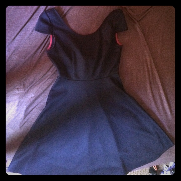 Navy blue skater dress with open back and pink bow