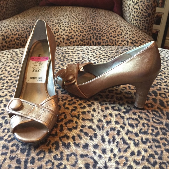 Gold open toed heels.