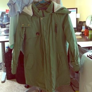 Green coat.
