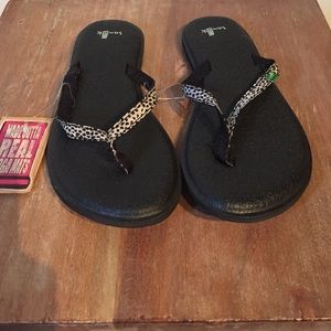 Sanuk slippers.
