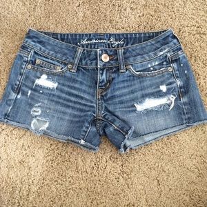 Ripped medium wash denim shorts