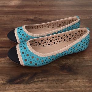 Turquoise color block flats.