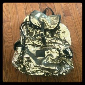 Victoria's Secret gold back pack. Offers welcome