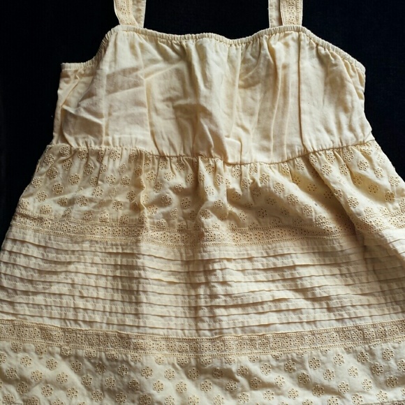Yellow tank top with designs and ruffles