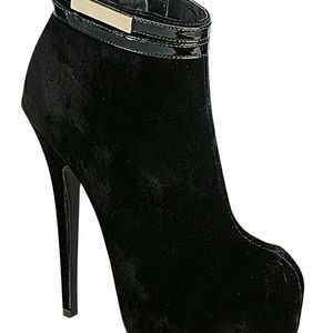 Slick black suede with gold and black belt.