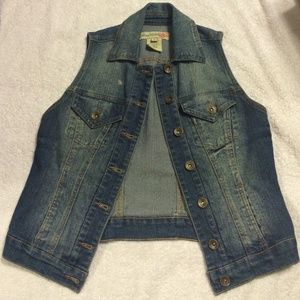 Dark wash vest.