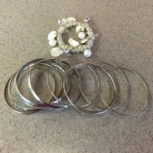 Silver Bangles and one silver/shell/pearl