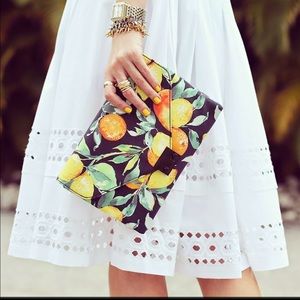 Loeffler Randall Lock clutch in citrus print.