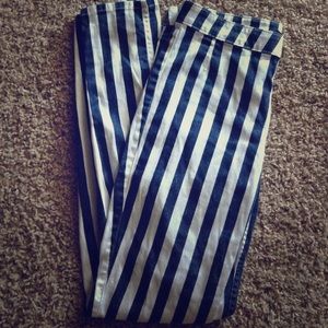Vertical navy blue and white striped pants.