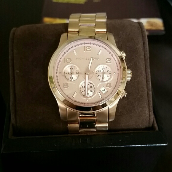 Michael kors rose gold watch.