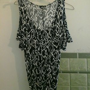 A black and white dress with a black belt