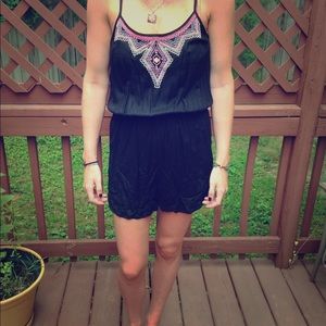 Black romper with multi colored embroidery