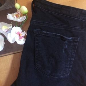 Distressed black AG denim