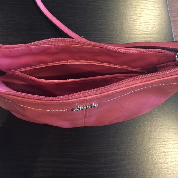 This is a pink coach Crossbody bag. - Picture 2 of 4