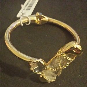 Gold tone cuff bracelet with clear stones
