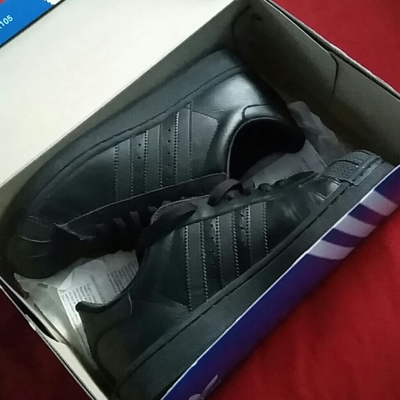 Adidas shell toes in black