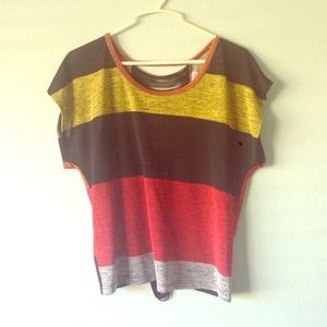 A small multi color top with fringe back