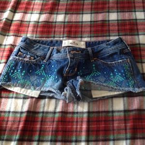 denim shorts with turquoise and blue detailing