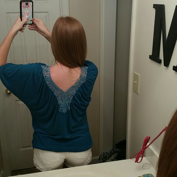 Teal shirt with lace detail on back