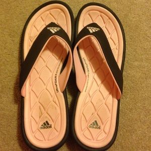 Adidas flip flops.