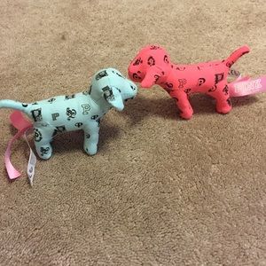 2 pink mini dogs