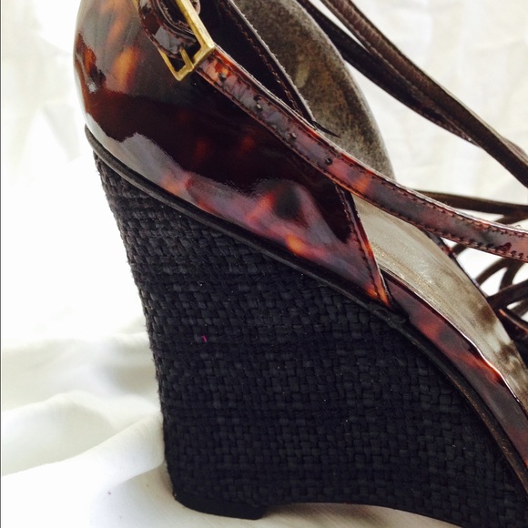 Tortoise shell woven wedge sandals.
