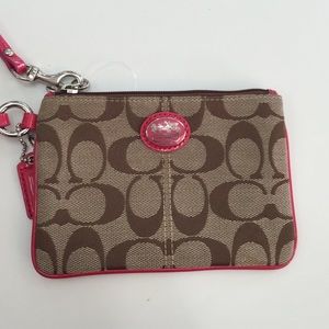 Coach tan/pink wristlet