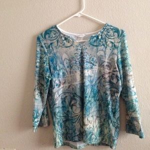 Decorative ocean blue long sleeved shirt.