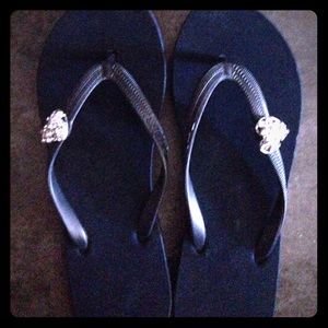 Navy flip flop with heart charms.