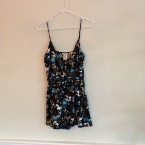 Patterned romper with skirt over shorts