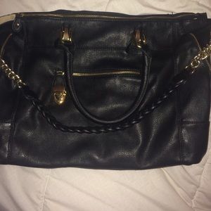 A big roomy black handbag.