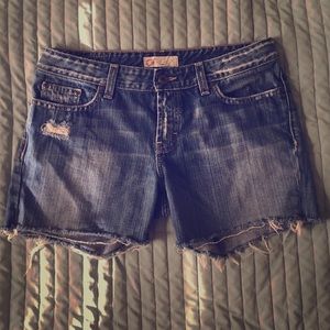 Distressed mid length cutoff shorts