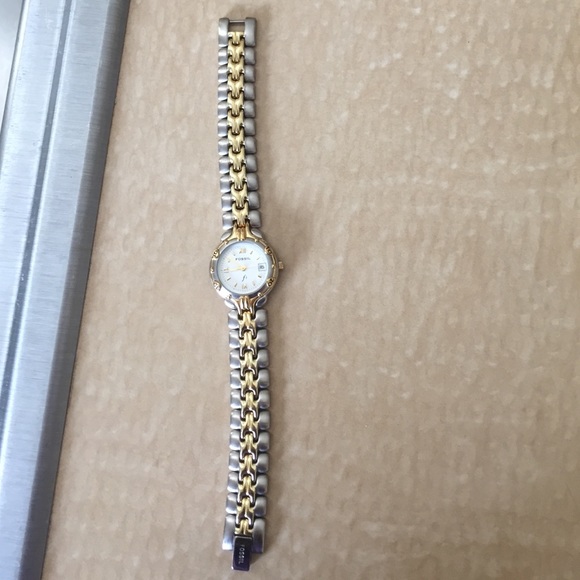 silver and gold fossil watch