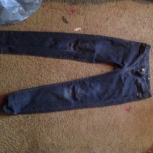 A pair of love culture jeans