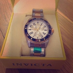 Invicta 18k gold and silver watch.