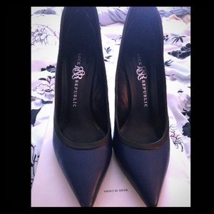 Navy blue and black high back pointy toe heels