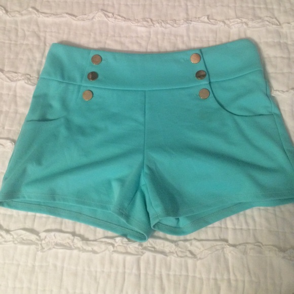 light blue high waisted shorts with gold buttons